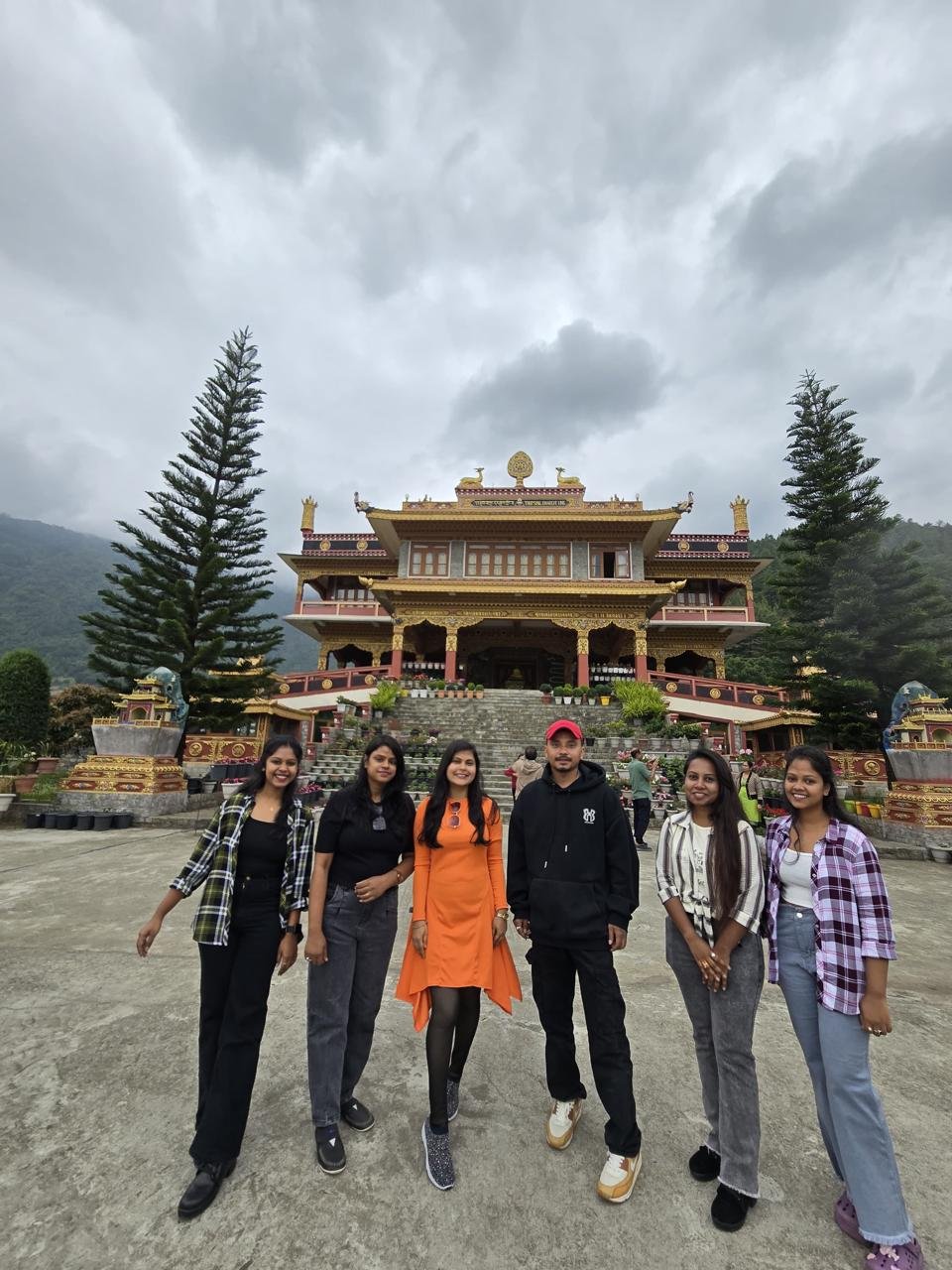 Happy tour group photo at Dirang Monastery with Dorjee Tours and Travels